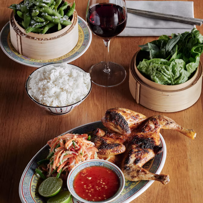 Grilled chicken with rice, greens, edamame and dipping sauce at ARC Rooftop