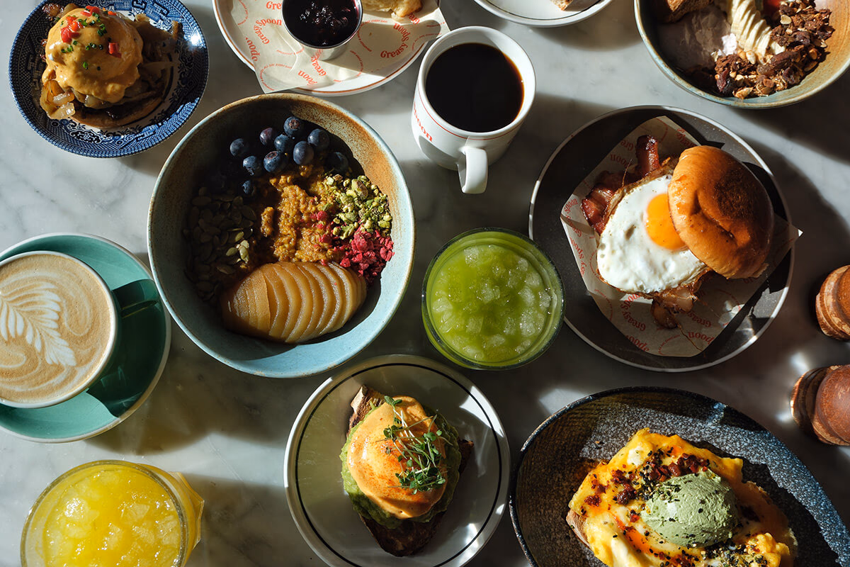 Brunch plates and coffee on a table at Greasy Spoon in Stockholm