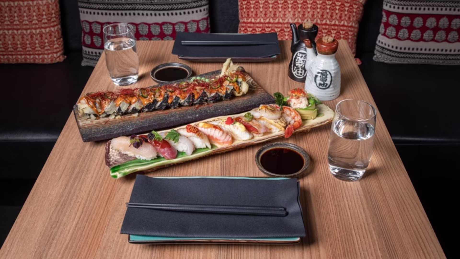 Nigiri and sushi rolls on long plates at Hattori Sushi Devil on Drottninggatan in Stockholm