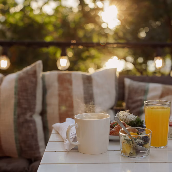 Coffee, orange juice and breakfast food on a table at Hotel Skeppsholmen