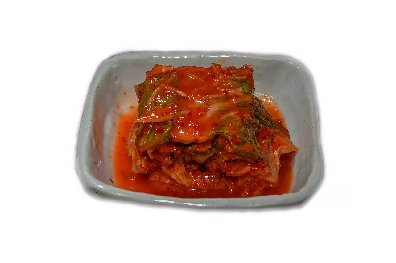 A bowl of red seasoned cabbage kimchi at Restaurang Kimchi in Stockholm